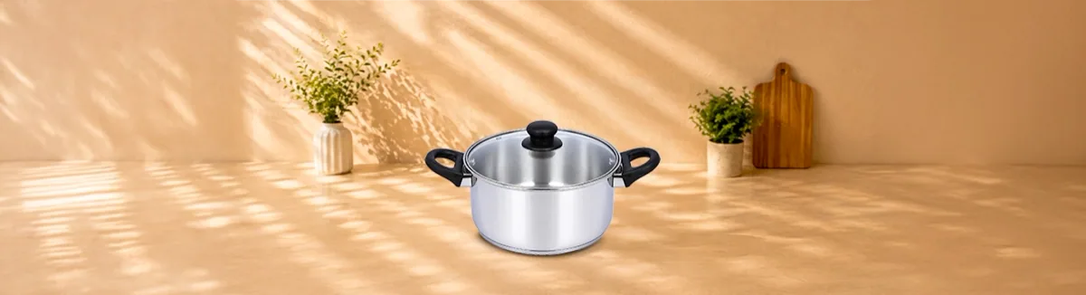 Steel casserole with black handles and a glass lid with a black knob