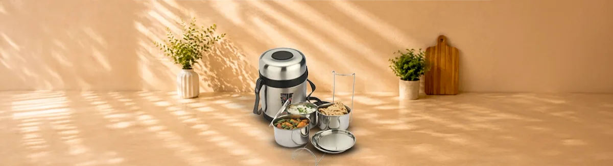 Insulated steel tiffin with a shoulder strap, three food containers and a lid