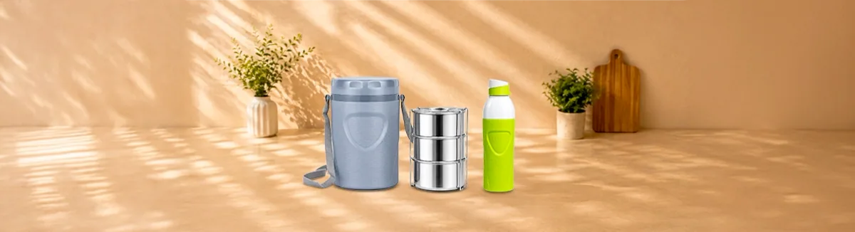 Grey insulated carrier, a three-tier steel tiffin and a green and white bottle