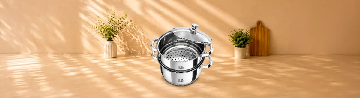 Two tier steel steamer with a perforated basket and a glass lid